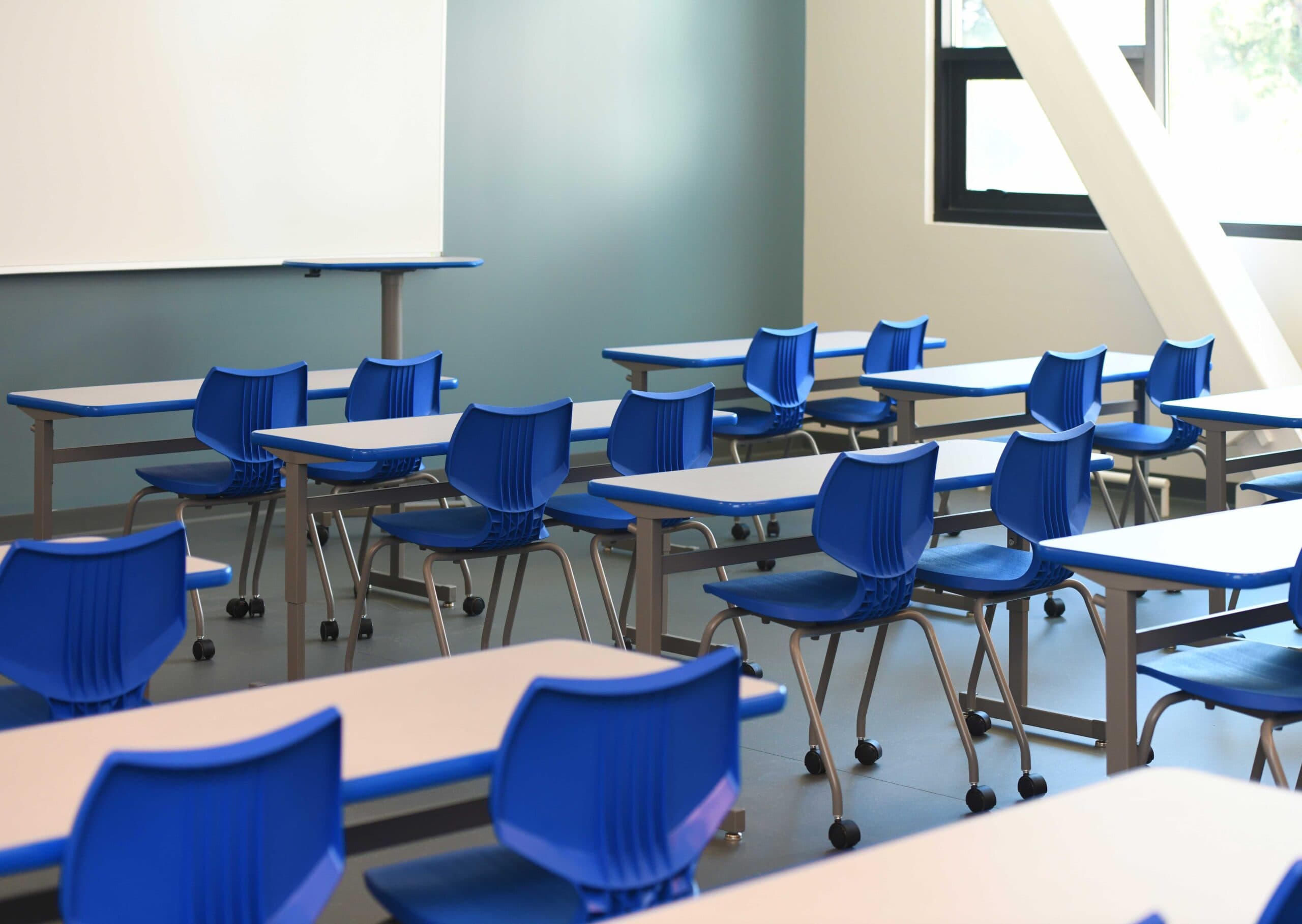 Modern classroom with desks and chairs for offline coaching